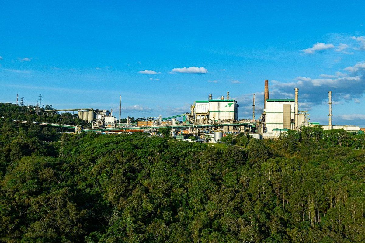 An industrial plant surrounded by greenery