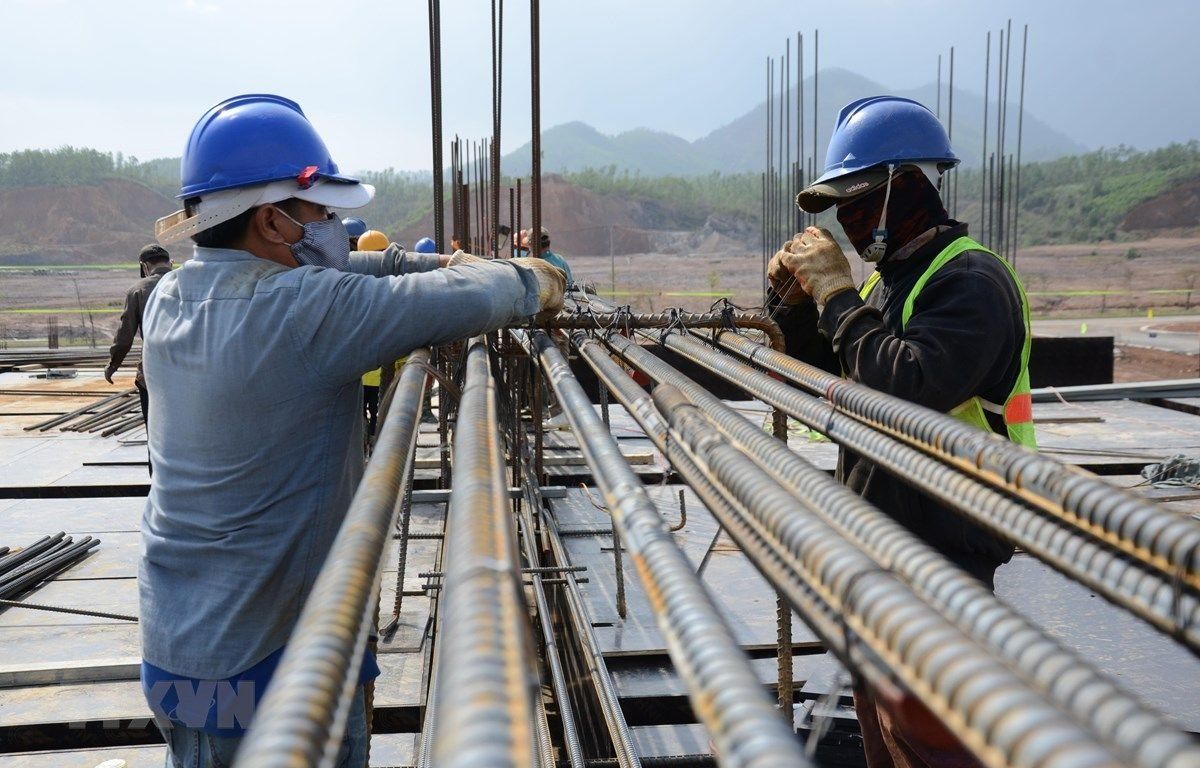 Workers checking steel materials on site